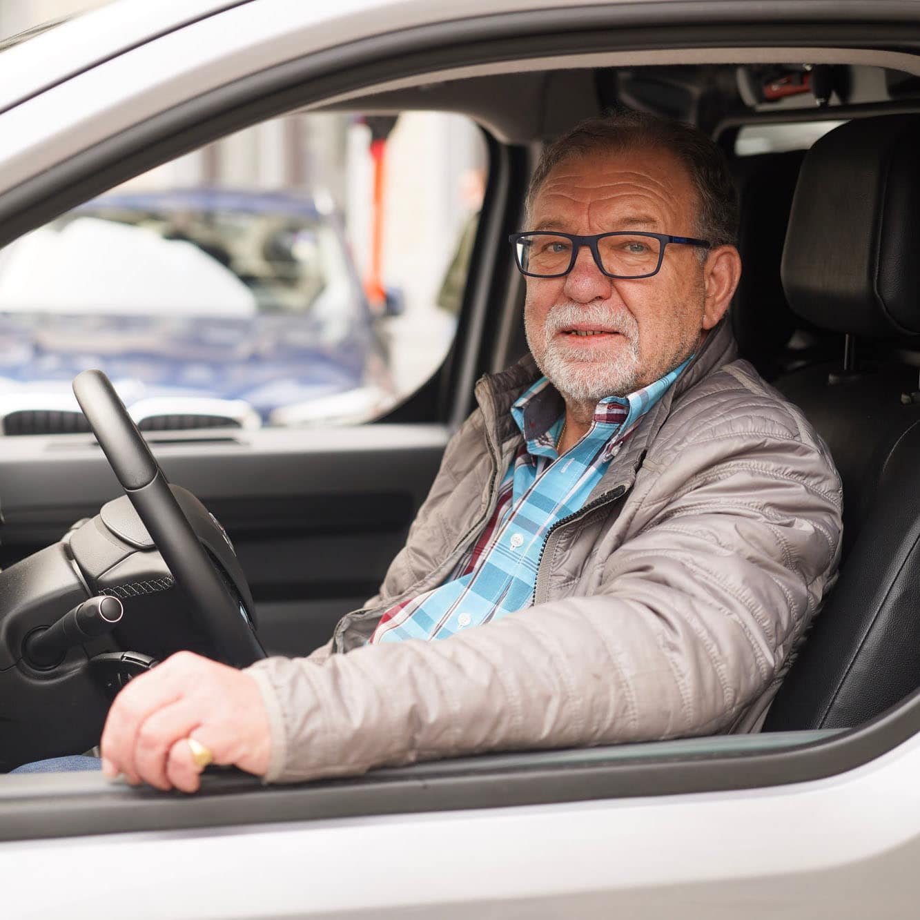 A volunteer driver in his van